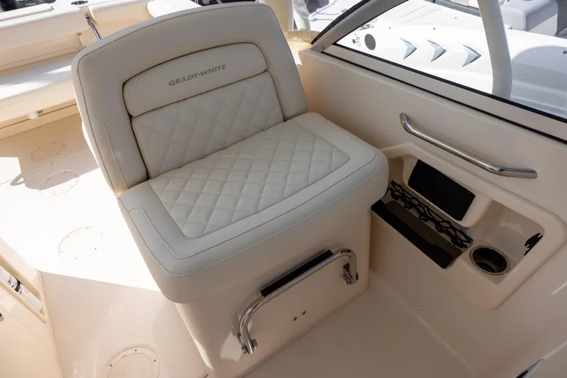 Slide: The Image of 2023 Grady-White Freedom 255 boat seat with quilted design and storage compartment. - 13