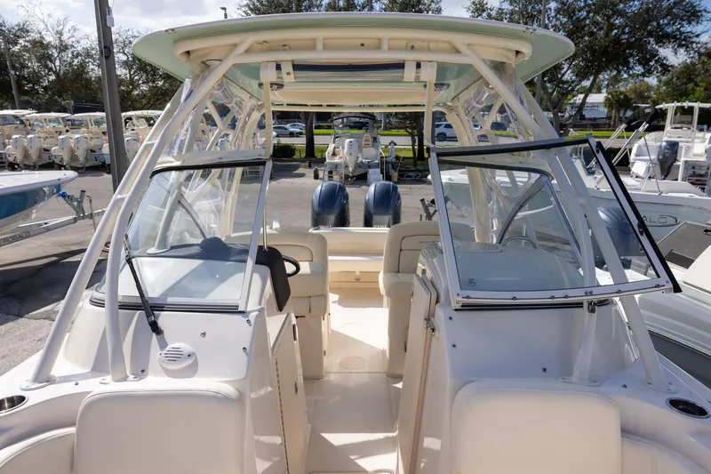 Slide: The Image of 2023 Grady-White Freedom 255 boat interior with open windshield and seating. - 17
