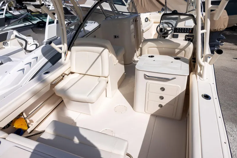 Slide: The Image of 2023 Grady-White Freedom 255 boat interior with seating and helm station. - 5