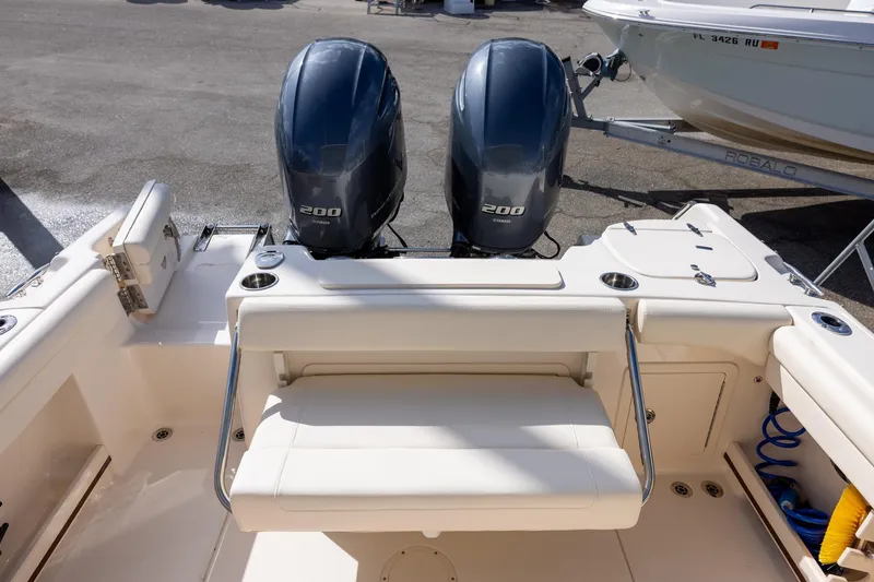 Slide: The Image of 2023 Grady-White Freedom 255 boat with dual 200 horsepower engines, rear seating view. - 6