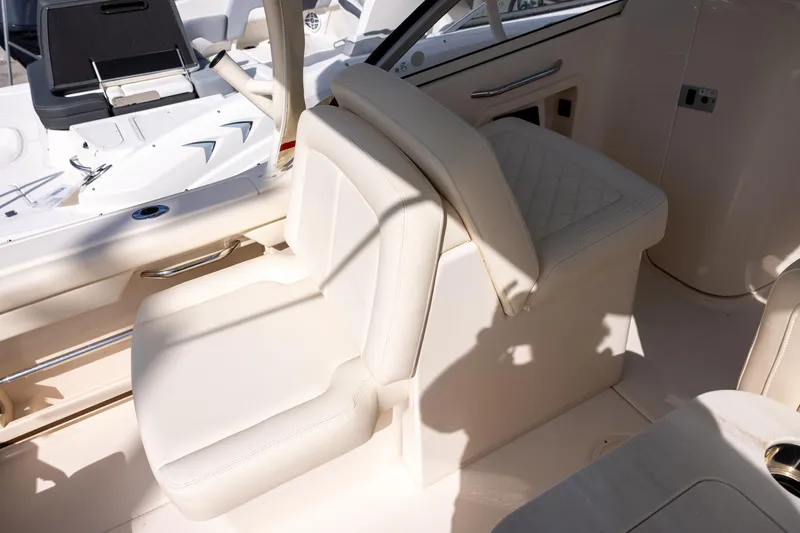 Slide: The Image of 2023 Grady-White Freedom 255 boat interior with luxurious seating. - 9