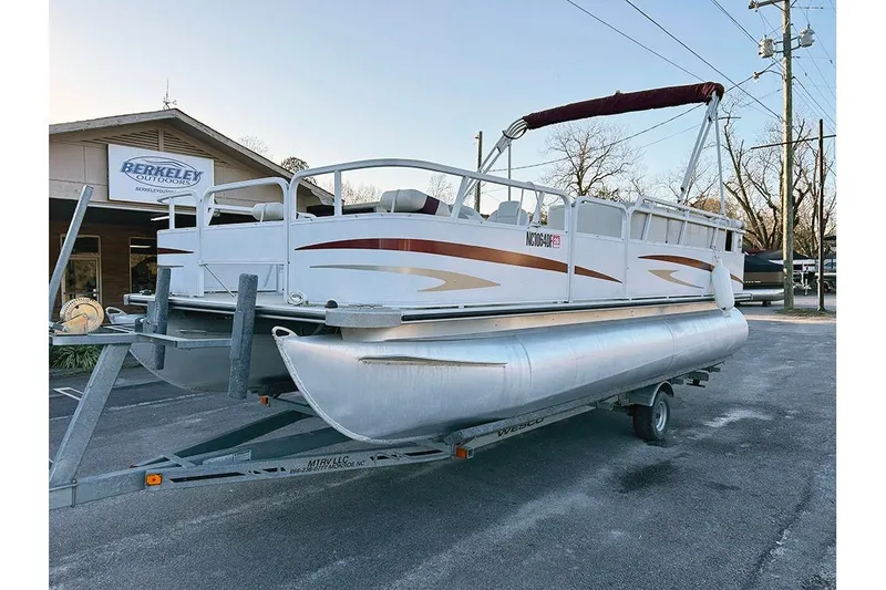 Slide: The Image of 2006 Bentley Pontoons 200 Fish on trailer, parked outside Berkeley Outdoors store. - 4