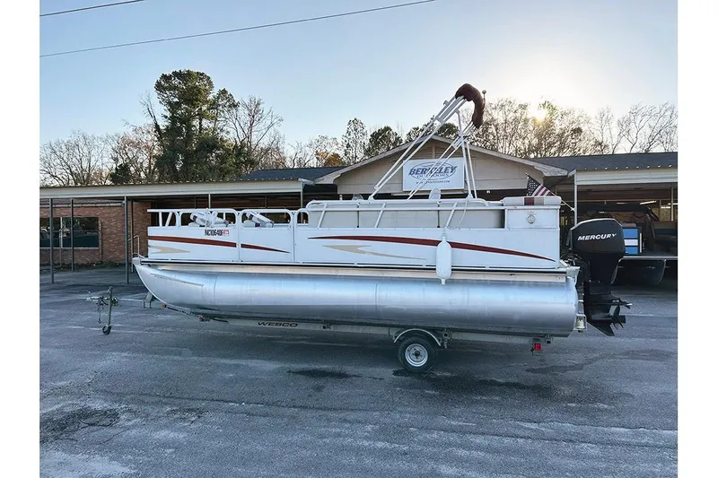 Slide: The Image of 2006 Bentley Pontoons 200 Fish on trailer, parked outdoors near a building. - 5