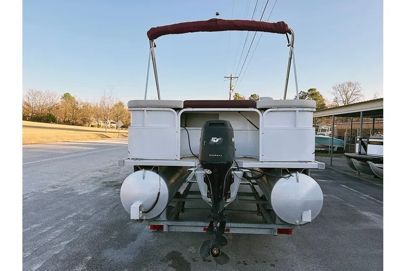 Slide: The Image of 2006 Bentley Pontoons 200 Fish boat, rear view with outboard motor, parked on trailer. - 7