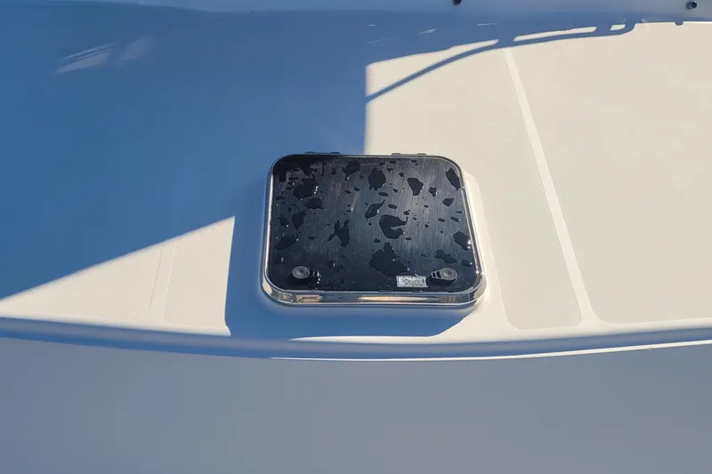 Slide: The Image of Hatch on 2015 Fortier 30 boat deck with water droplets. - 11