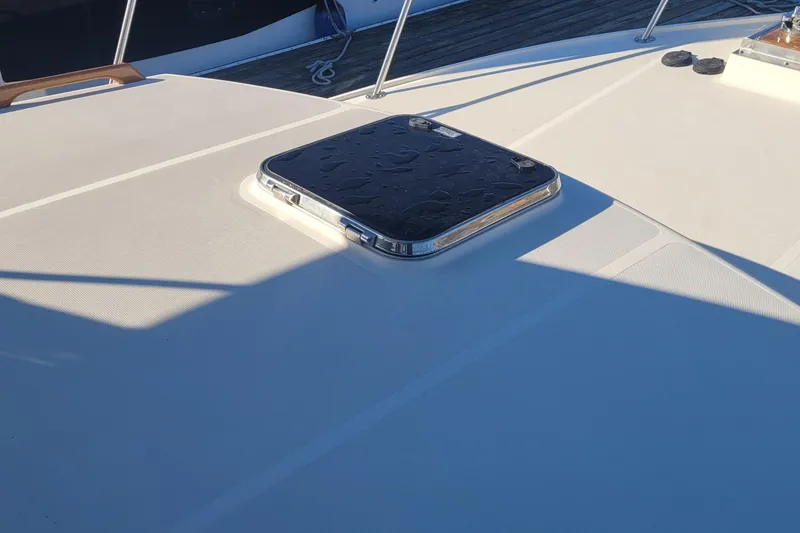 Slide: The Image of Fortier 30 boat deck with hatch, 2015 model, sunlight casting shadows. - 12