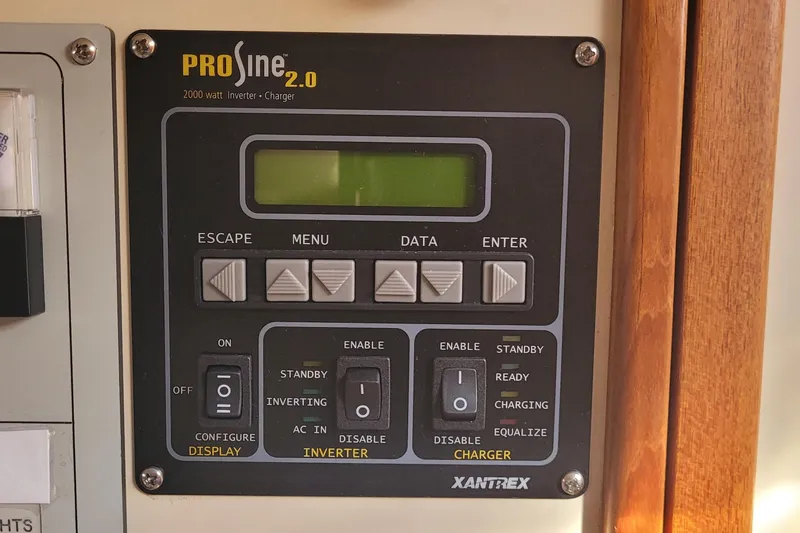 Slide: The Image of Control panel of Xantrex PROsine 2.0 inverter charger on a 2015 Fortier 30 boat. - 18