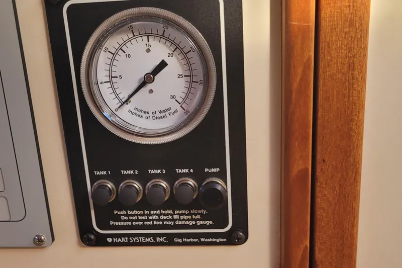Slide: The Image of Gauge panel on Fortier 30 boat, displaying water and diesel fuel levels, 2015 model. - 19
