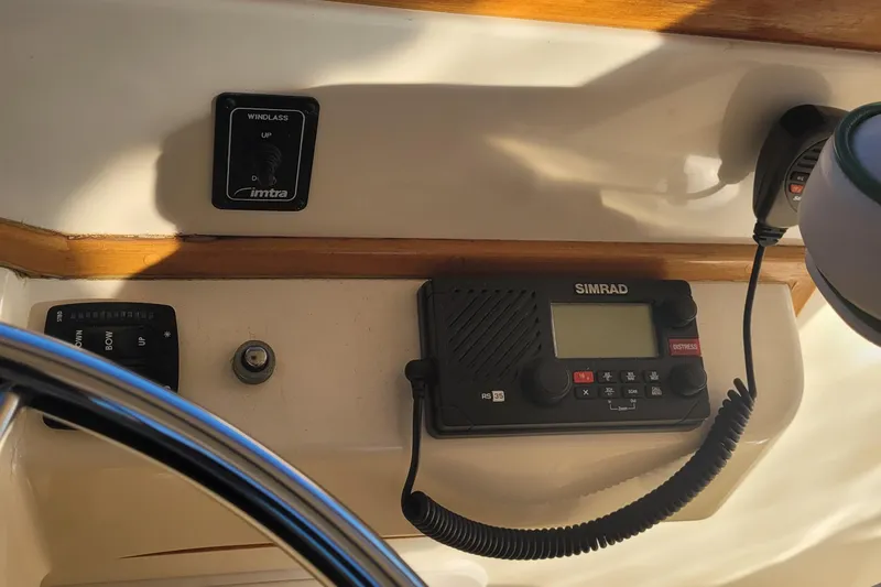 Slide: The Image of Control panel of a 2015 Fortier 30 boat with Simrad radio and windlass switch. - 35