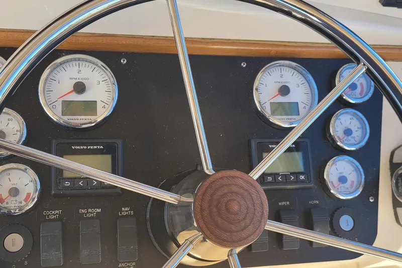Slide: The Image of Steering wheel and dashboard of 2015 Fortier 30 boat with Volvo Penta gauges. - 37