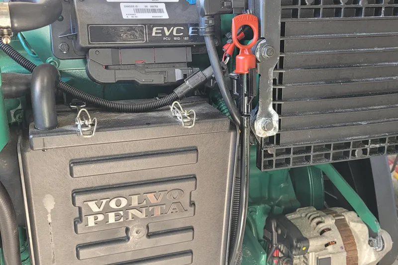 Slide: The Image of Volvo Penta engine in a 2015 Fortier 30 boat, showcasing components and wiring. - 44