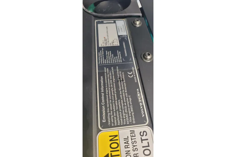 Slide: The Image of Emission control information label on a 2015 Fortier 30 boat engine. - 47