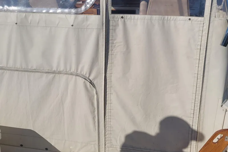 Slide: The Image of Fortier 30 boat canvas enclosure, 2015 model, with visible stitching and shadow. - 55