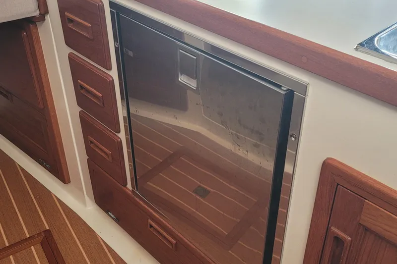 Slide: The Image of Wooden cabinet and toilet paper holder in 2015 Fortier 30 boat interior. - 28