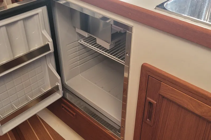 Slide: The Image of Interior of 2015 Fortier 30 boat with sink and storage cabinets. - 29