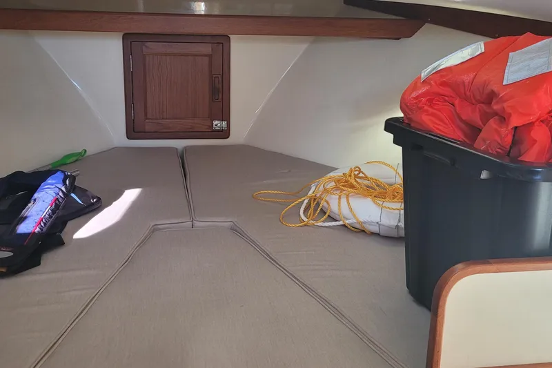 Slide: The Image of Interior of 2015 Fortier 30 boat with wooden cabinetry and stainless steel appliance. - 30