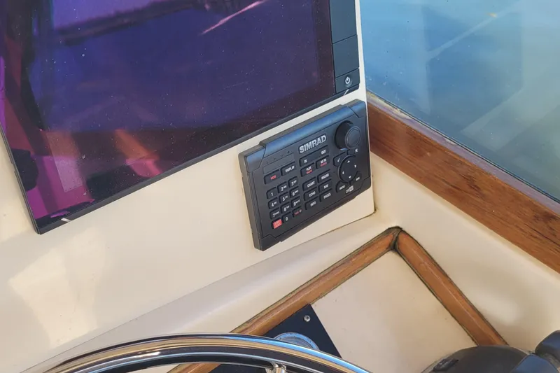 Slide: The Image of Boat dashboard with navigation screens and controls, Fortier 30, 2015 model. - 36