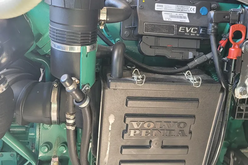 Slide: The Image of Engine compartment of a 2015 Fortier 30 boat with hoses and components. - 43