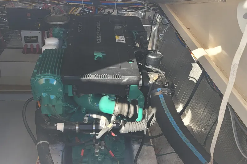 Slide: The Image of Engine room of a 2015 Fortier 30 boat with electrical components and wiring. - 53