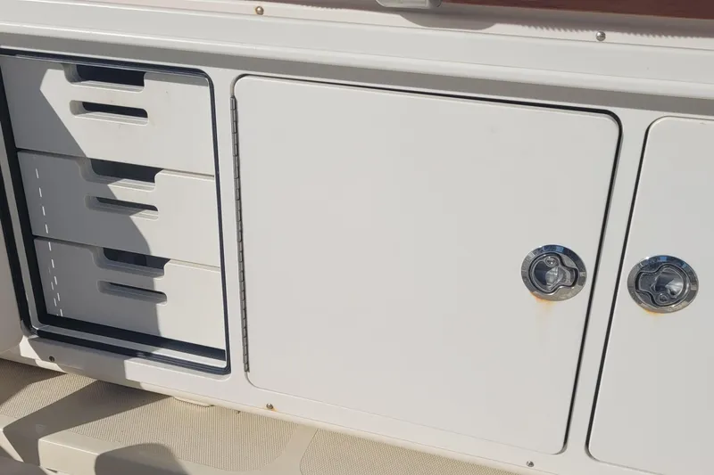 Slide: The Image of Engine compartment of a 2015 Fortier 30 boat, showcasing mechanical components and wiring. - 54