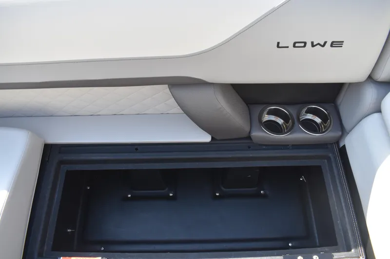 Slide: The Image of 2026 Lowe SF 232 Sport Fish boat interior with storage compartment and cup holders. - 14
