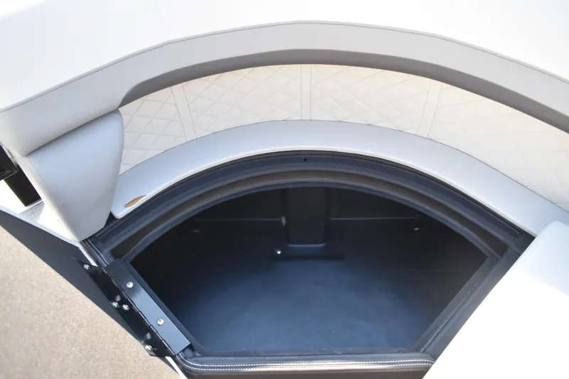 Slide: The Image of 2026 Lowe SF 232 Sport Fish boat storage compartment with cushioned seating. - 15