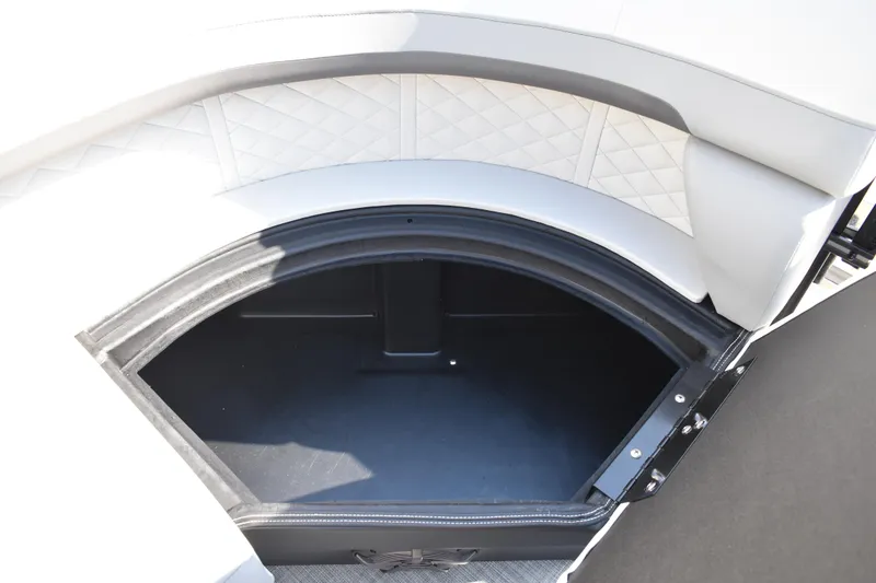 Slide: The Image of 2026 Lowe SF 232 Sport Fish boat storage compartment with cushioned seating. - 20