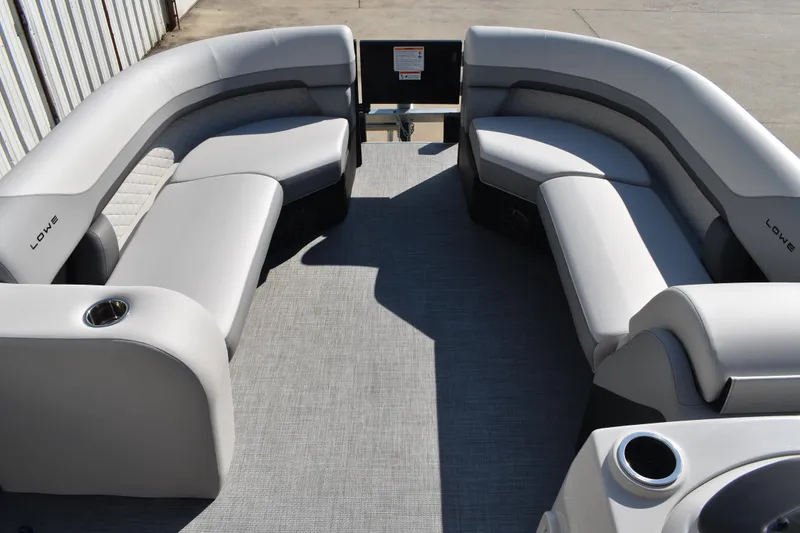 Slide: The Image of 2026 Lowe SF 232 Sport Fish boat interior with gray seating and cup holders. - 21