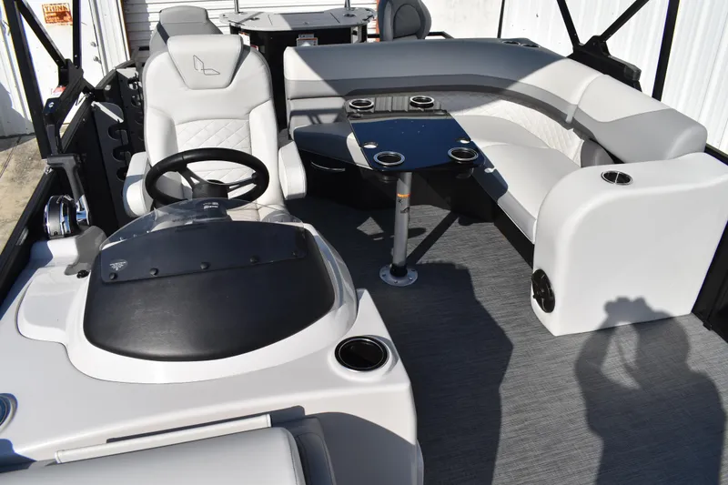 Slide: The Image of 2026 Lowe SF 232 Sport Fish boat interior with seating and steering wheel. - 23
