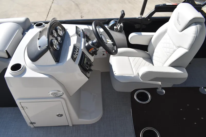 Slide: The Image of 2026 Lowe SF 232 Sport Fish boat interior with steering console and cushioned seat. - 24