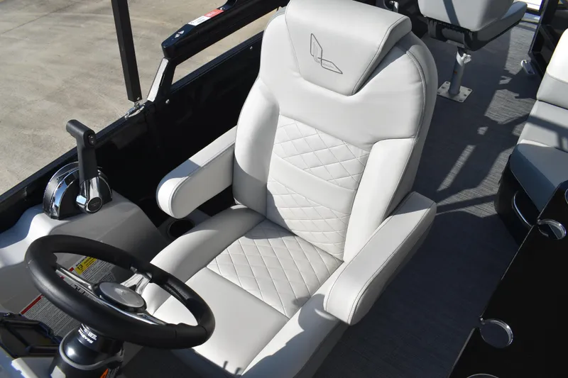Slide: The Image of Captain's seat of 2026 Lowe SF 232 Sport Fish boat, featuring sleek design and controls. - 27