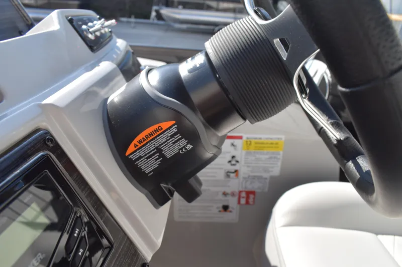 Slide: The Image of Steering wheel and controls of 2026 Lowe SF 232 Sport Fish boat. - 33