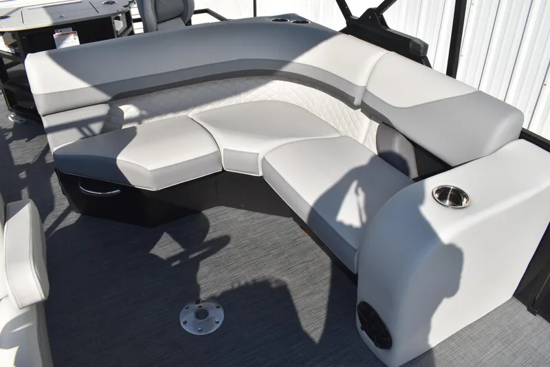 Slide: The Image of 2026 Lowe SF 232 Sport Fish boat interior with gray cushioned seating and cup holders. - 35