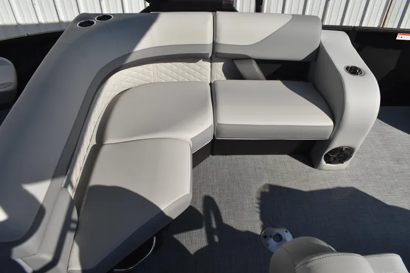 Slide: The Image of 2026 Lowe SF 232 Sport Fish boat interior with gray cushioned seating and cup holders. - 36