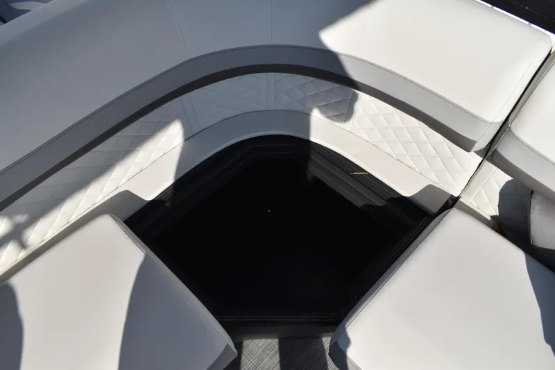 Slide: The Image of 2026 Lowe SF 232 Sport Fish boat interior with white cushioned seating and diamond-patterned upholstery. - 39