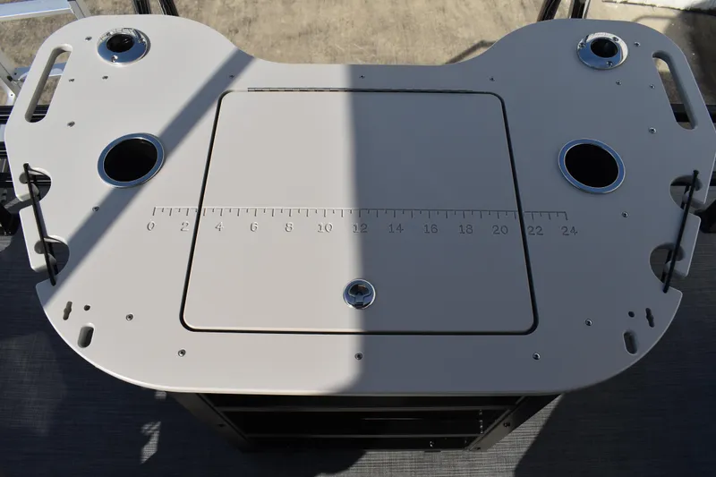 Slide: The Image of Fishing station on 2026 Lowe SF 232 Sport Fish boat with built-in rod holders and measuring scale. - 43