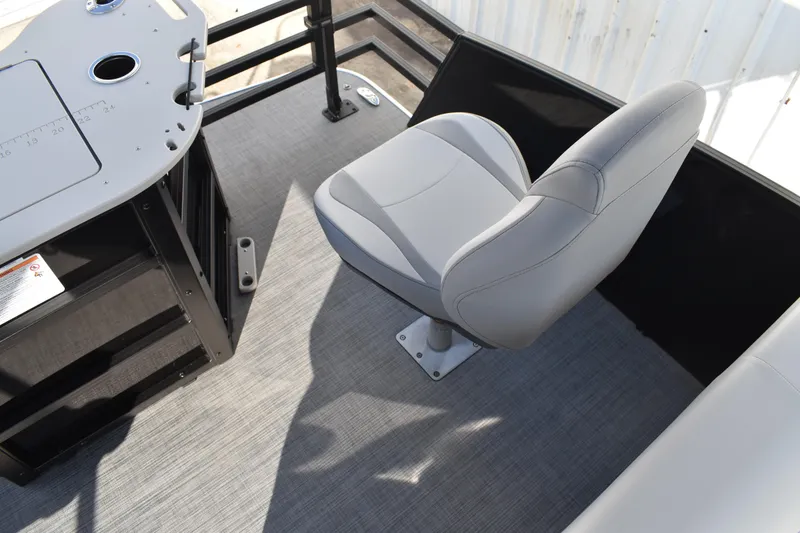 Slide: The Image of 2026 Lowe SF 232 Sport Fish boat interior with gray seating and fishing station. - 45