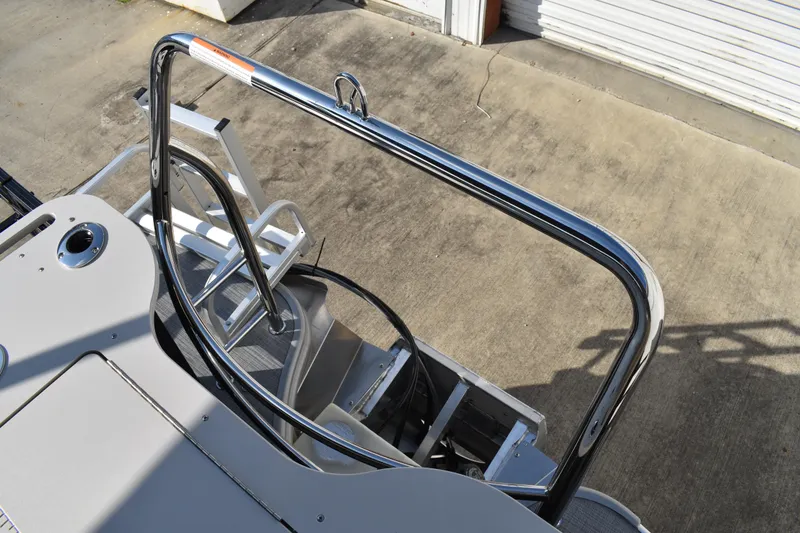 Slide: The Image of 2026 Lowe SF 232 Sport Fish boat with sleek chrome railing and ladder. - 47