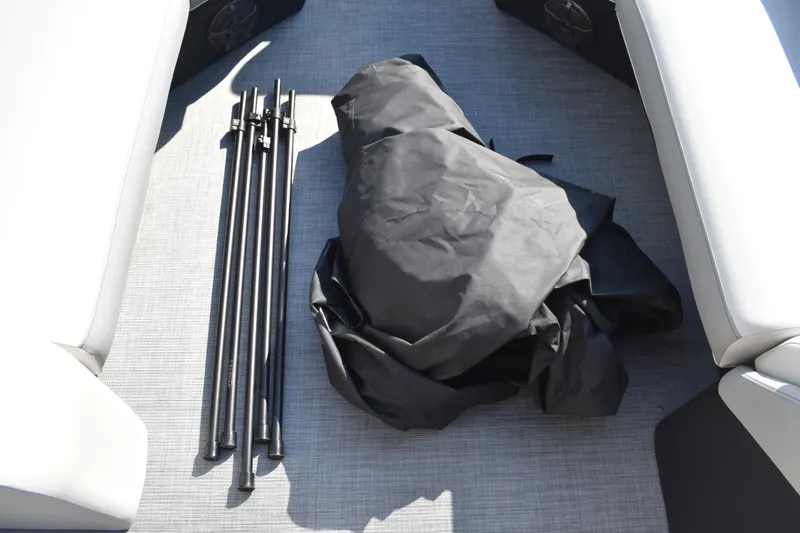 Slide: The Image of 2026 Lowe SF 232 Sport Fish boat interior with black poles and cover on deck. - 48