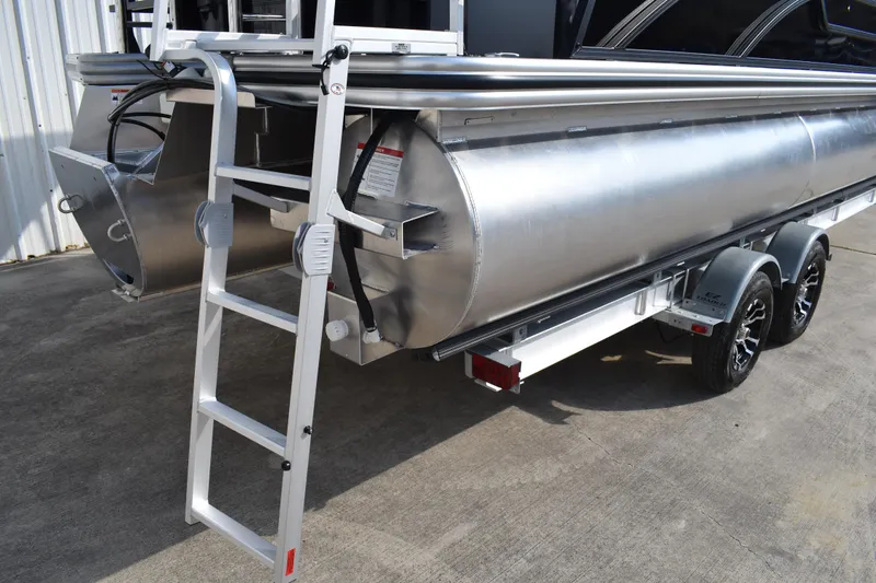 Slide: The Image of 2026 Lowe SF 232 Sport Fish pontoon boat with ladder and trailer. - 6