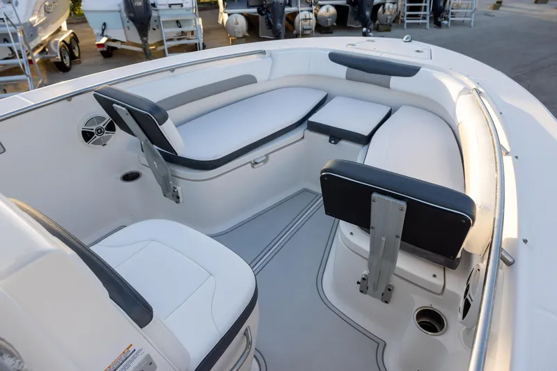 Slide: The Image of 2019 Robalo R202 Explorer boat interior with cushioned seating and modern design. - 11