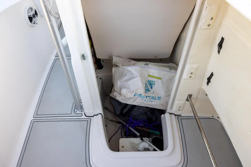 Slide: The Image of 2019 Robalo R202 Explorer storage compartment with boating gear and accessories. - 12