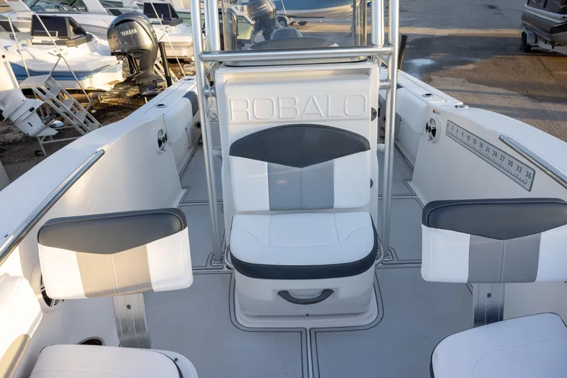 Slide: The Image of 2019 Robalo R202 Explorer boat interior with seating and measurement guide. - 14