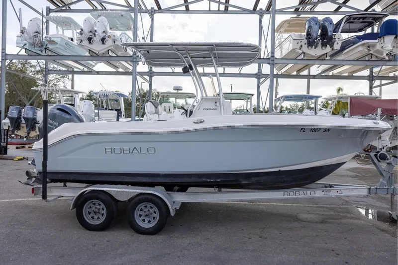 Slide: The Image of 2019 Robalo R202 Explorer boat on trailer in marina storage. - 3