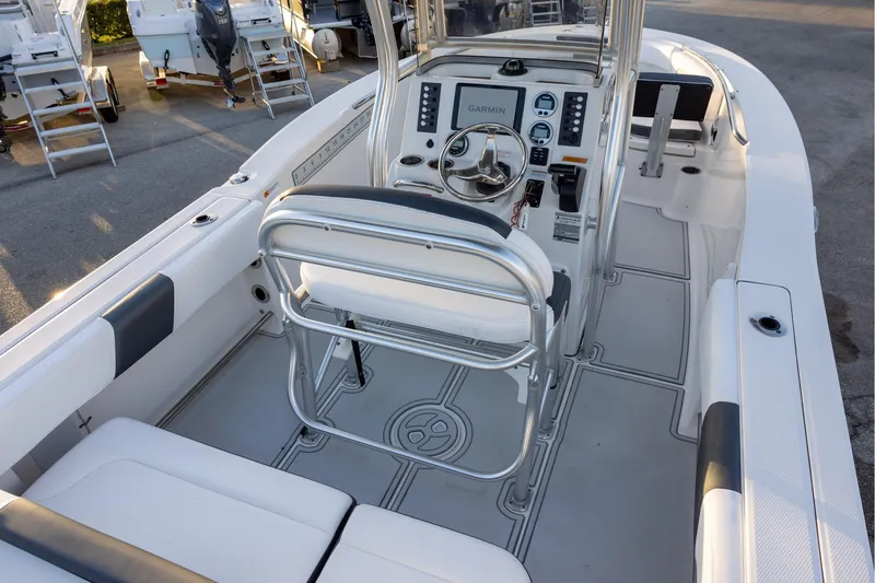 Slide: The Image of 2019 Robalo R202 Explorer boat interior with steering console and seating. - 6
