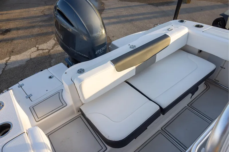 Slide: The Image of 2019 Robalo R202 Explorer boat interior with Yamaha 200 engine, featuring white seating. - 7