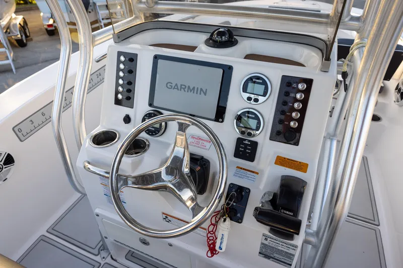 Slide: The Image of Control panel of 2019 Robalo R202 Explorer boat with Garmin navigation system. - 9