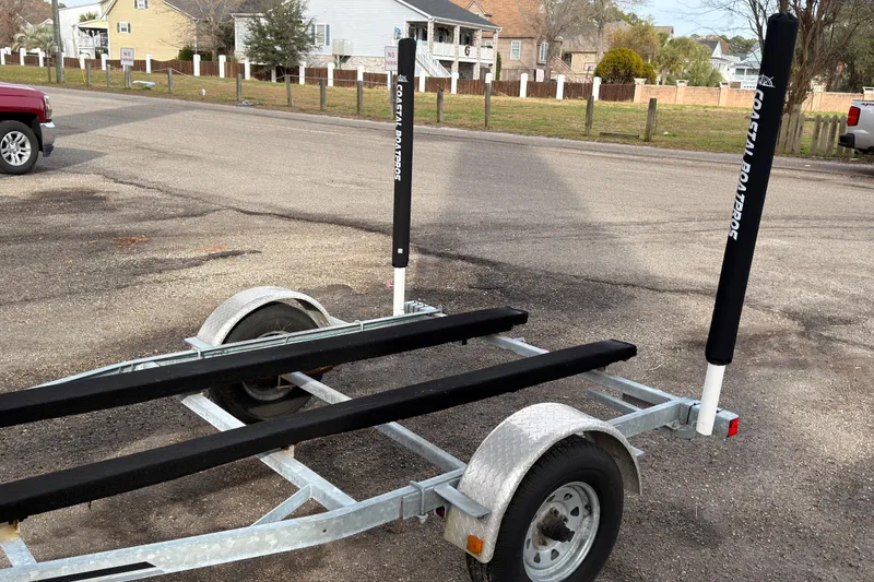 Slide: The Image of Boat trailer for 2017 Carolina Skiff 18 JVX CC in a parking lot. - 11