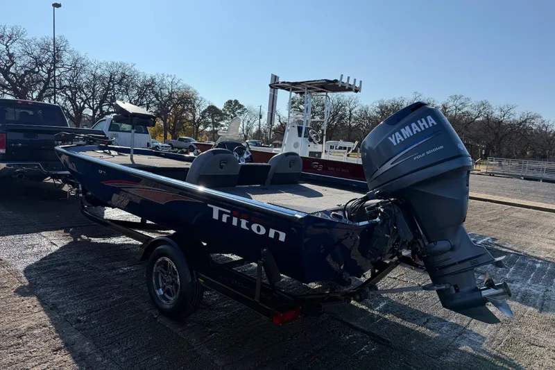 Slide: The Image of 2020 Triton 17 TX boat with Yamaha engine on trailer in parking lot. - 10