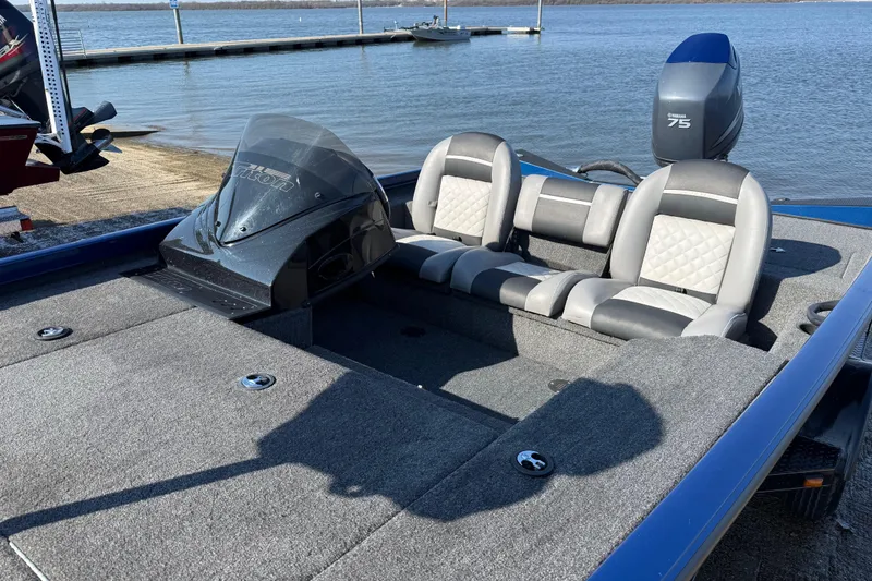 Slide: The Image of 2020 Triton 17 TX boat with Yamaha 75 engine, docked by a lake. - 18